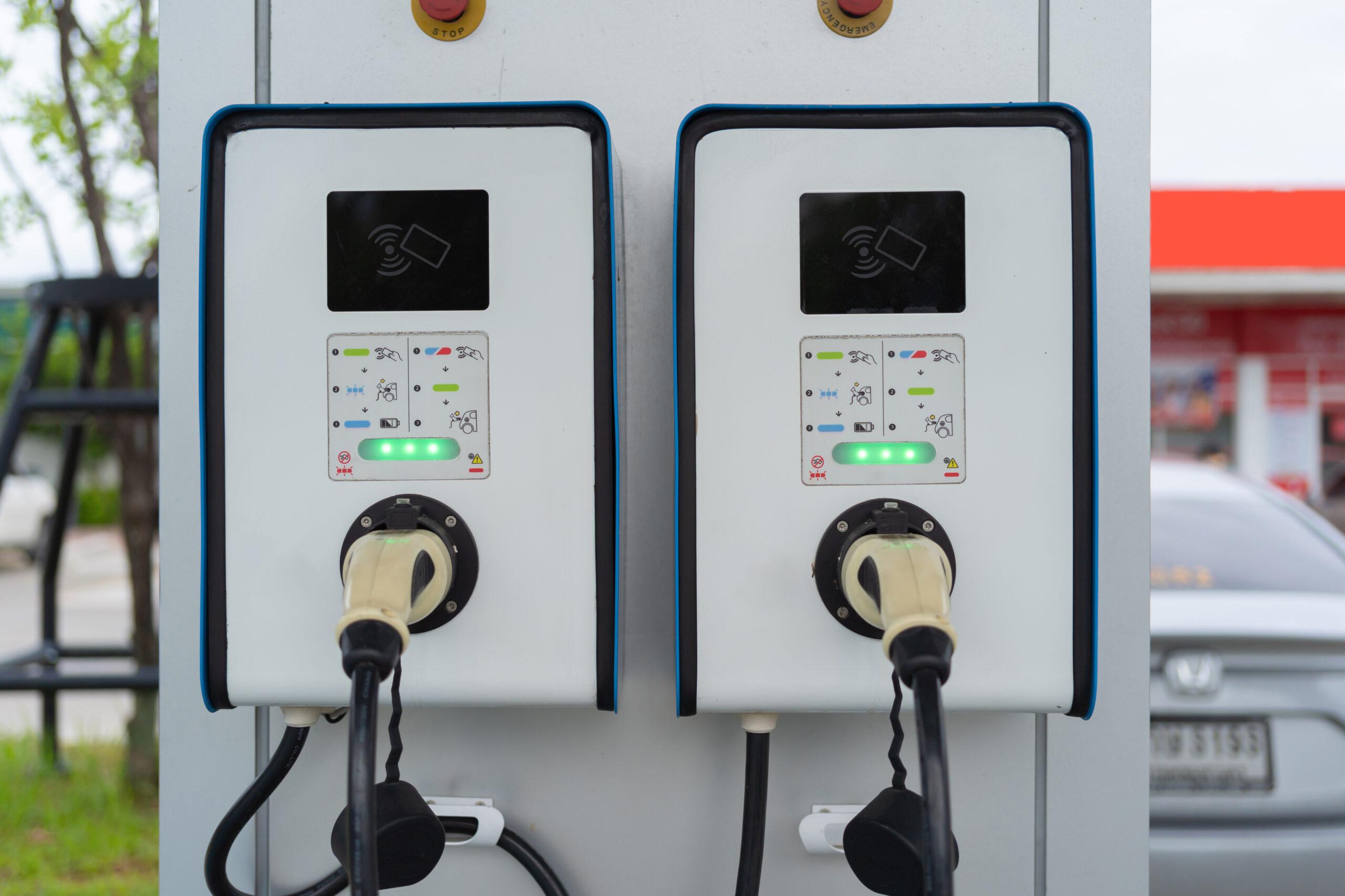 Cable from EV car charger or electric vehicle station. Cable connected at gas station, power supply battery charging an alternative eco environment future technology energy innovation