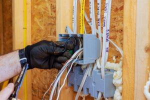imgi_11_electrician-working-on-circuit-box-installation-during-home-renovation-project-in-a