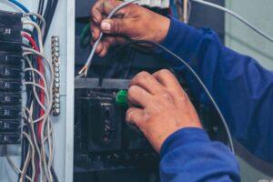 electrical-mechanic-technician-check-wire-electric-cabinet-inspector-men-hands-working