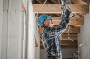 professional-electrician-installing-ceiling-light-point