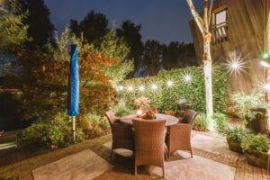 Courtyard with full of greenery and wicker chairs
