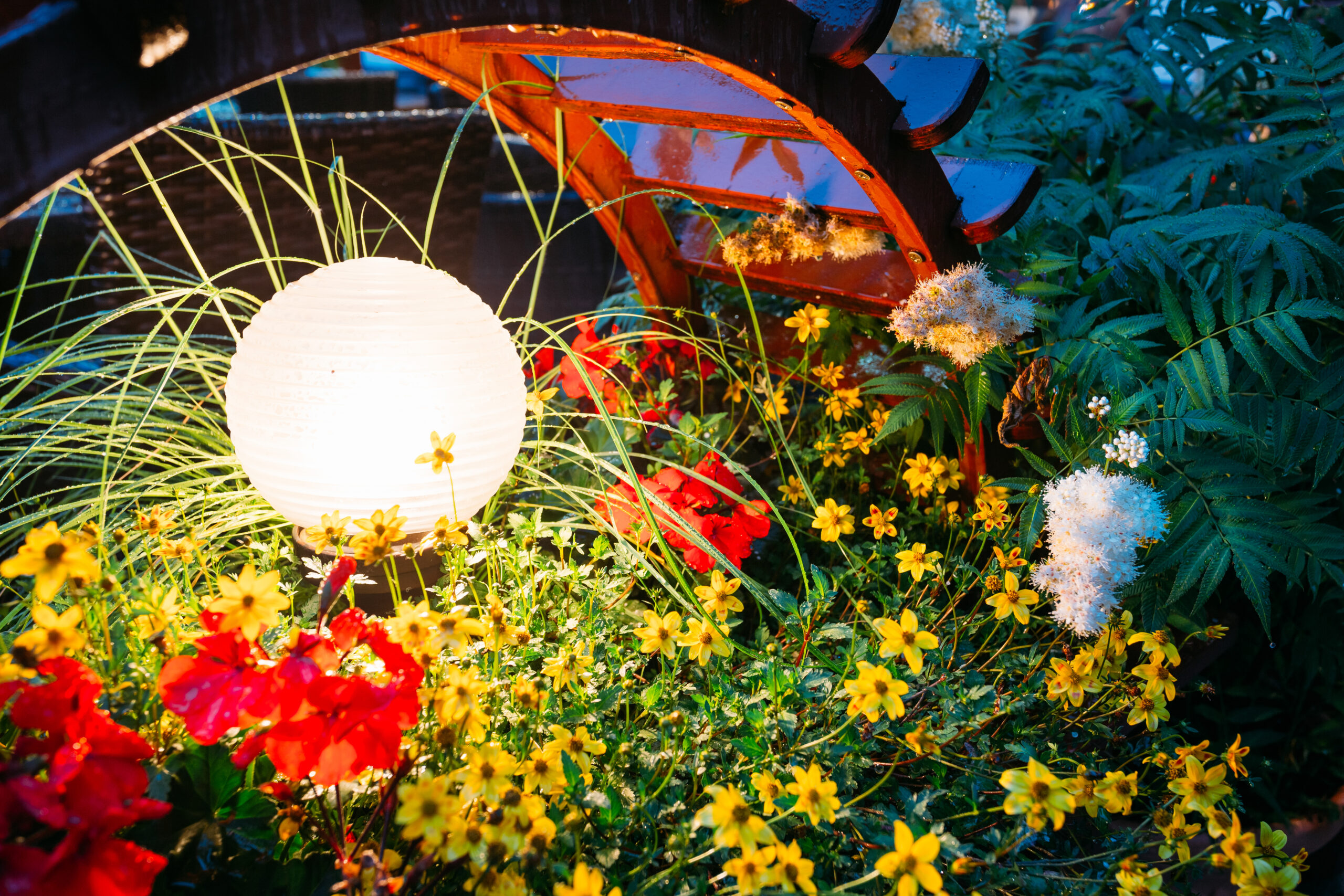 Decorative Small Garden Light, Lanterns In Flower Bed In Green Foliage. Garden Design.