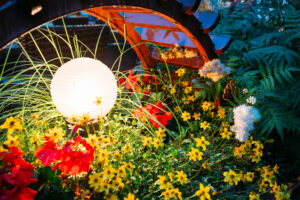 Decorative Small Garden Light, Lanterns In Flower Bed In Green Foliage. Garden Design.