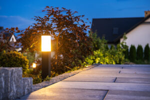 Modern Landscaping Theme. Residential Garden Illuminated by LED Outdoor Garden Lighting